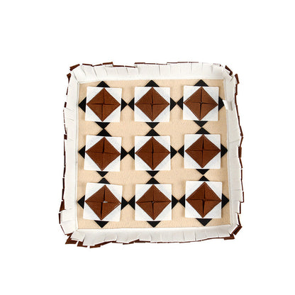 The dog sniffs the mat